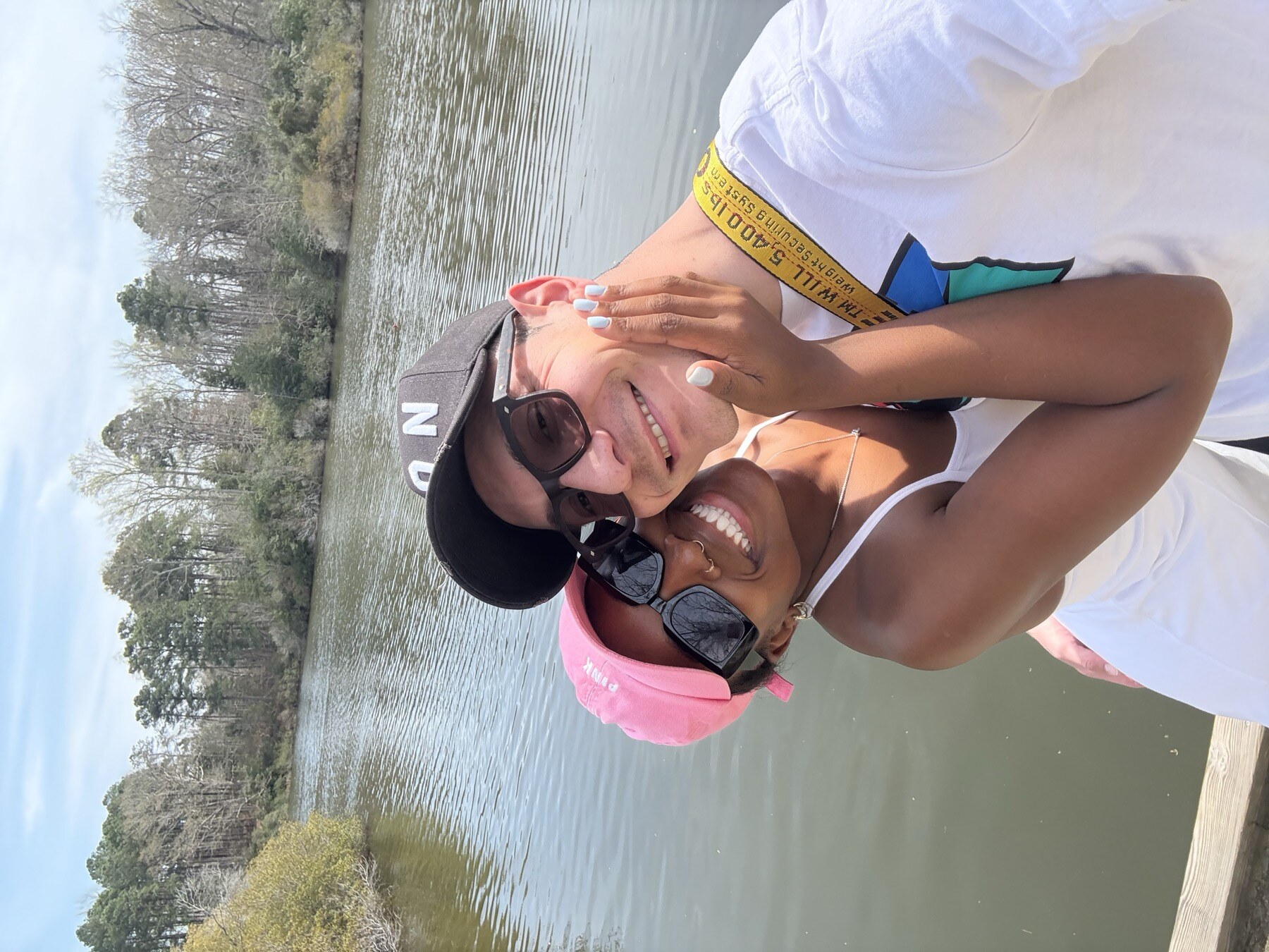 Antonio and Kirsten at a lake, back of the frame.
